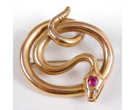 An early 20th century yellow metal snake brooch, set with a 4.4 x 4.5mm ruby in the head with two 1.7mm old cut diamonds for 