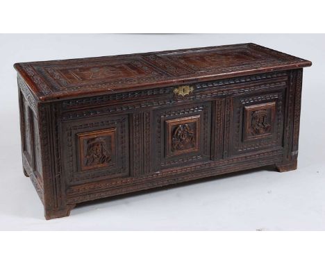 *A circa 1700 joined oak three panel coffer, the two panel hinged cover on replacement iron strap hinges, opening to reveal c