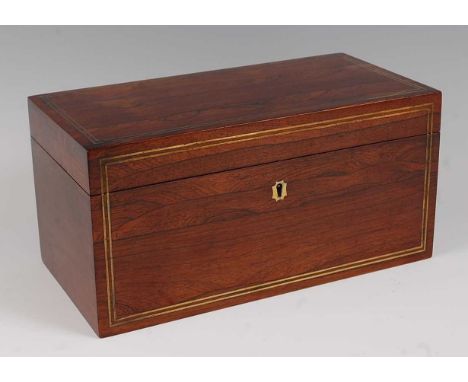 A Regency rosewood and brass strung tea caddy, having a fitted interior, with centre glass mixing bowl flanked by two mahogan