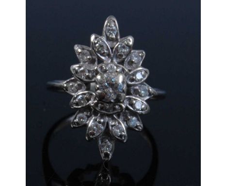 A white metal marquise shaped diamond cluster ring, featuring 19 round brilliant cut diamonds in foliate settings, diamond di