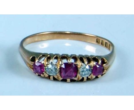 An early 20th century 18ct yellow gold, ruby and diamond half hoop eternity ring, with three graduated rectangular cut rubies