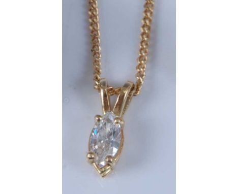 An 18ct yellow gold single stone marquise cut diamond pendant, with four claw setting and split bale, attached to a filed cur