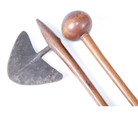 A 19th century Zulu war axe, having a flattened crescent shaped blade mounted on a tapering wooden haft, length 73cm; togethe