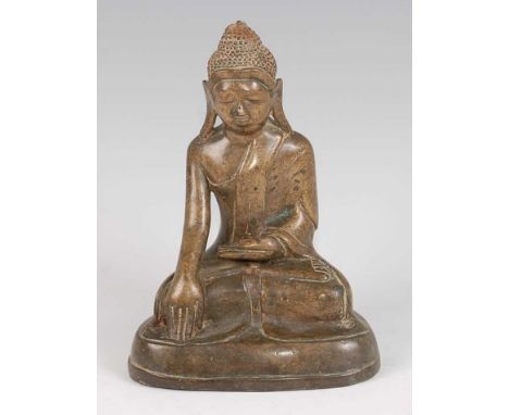 A 19th century Indian bronze Buddha in Bhumisparsha Mudra pose, h.18.5cm