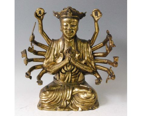 A 19th century gilt bronze Avalokiteśvara Buddhist deity, having eight pairs of arms bearing symbolic items including cymbals