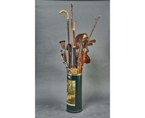 MISCELLANEOUS WALKING CANES, STICKS, UMBRELLAS, HICKORY SHAFTED GOLF CLUBS, CRICKET BAT, WARMING PAN, ETC, IN A DECORATIVE GR