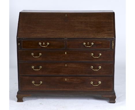 A GEORGE III MAHOGANY BUREAU, C1800, THE FALL-FLAP REVEALING CONVENTIONALLY FITTED INTERIOR ABOVE A PAIR OF SLIDES, TWO SHORT