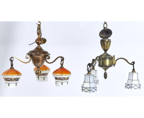 TWO OXIDISED BRASS THREE-LIGHT CHANDELIERS WITH CONTEMPORARY WHITE OR ORANGE GLASS SHADES, C1930, APPROXIMATELY 43 AND 47CM H