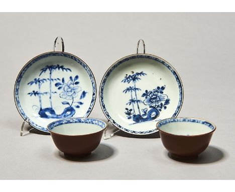 TWO CHINESE NANKING CARGO 'BATAVIAN BAMBOO AND PEONY' PATTERN TEA BOWLS AND SAUCERS, C1750, THE CAFE AU LAIT GROUND BLUE AND 