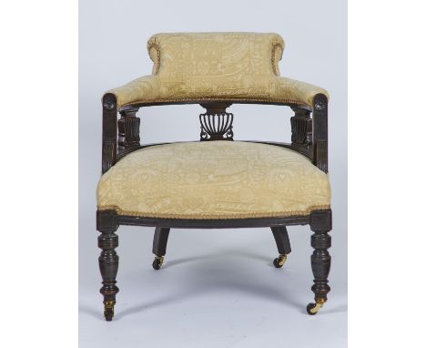 A LATE VICTORIAN MAHOGANY SALON TUB CHAIR WITH OVERSCROLLED UPHOLSTERED BACK ABOVE THREE PIERCED VASE SHAPED SPLATS, STUFFED 