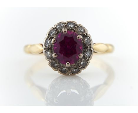 A DIAMOND AND SYNTHETIC RUBY CLUSTER RING, GOLD HOOP MARKED 18CT, 3.4G, SIZE N Condition reportRed stone with slight abrasion