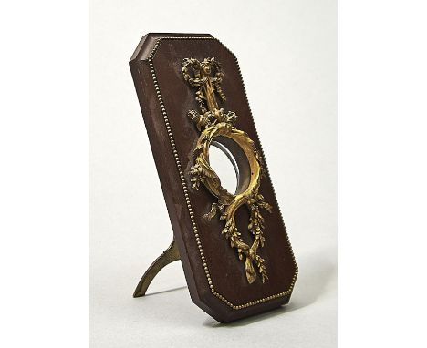 A FRENCH ORMOLU MOUNTED MAHOGANY STRUT CLOCK-FRAME, C1900, IN LOUIS XV STYLE, OF FESTOON FORM MOUNTED WITH PUTTO'S QUIVER AND