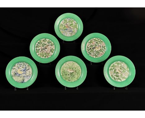 A SET OF SIX WEDGWOOD EARTHENWARE PLATES PAINTED BY ALFRED POWELL, C1930, EACH WITH A DIFFERENT BIRD ON A BRANCH OR AMIDST FO