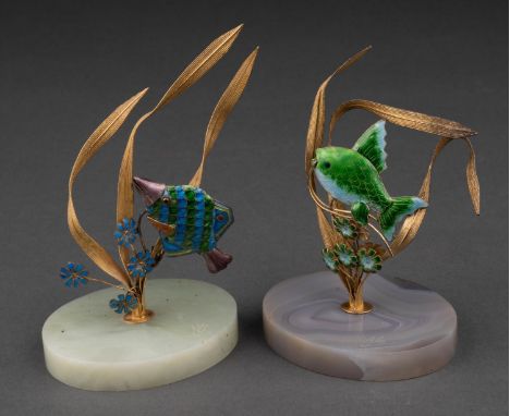 A PAIR OF SOUTH EAST ASIAN GILT SILVER COLOURED METAL AND TRANSLUCENT ENAMEL FISH ORNAMENTS, 20TH C, ON OVAL ONYX OR AGATE BA