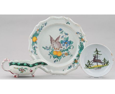 AN ITALIAN MAIOLICA SAUCER, PLATE AND SAUCEBOAT, LATE 18TH AND EARLY 19TH C, THE SAUCE BOAT PAINTED WITH MOTHS AND FLOWERS BE