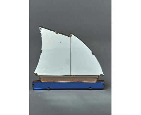 AN ART DECO GLASS SAILING SHIP NOVELY EASEL MIRROR, C1930,&nbsp; WITH BEVELLED SAILS, PINK HULL AND ELECTRIC BLUE WATER, BACK