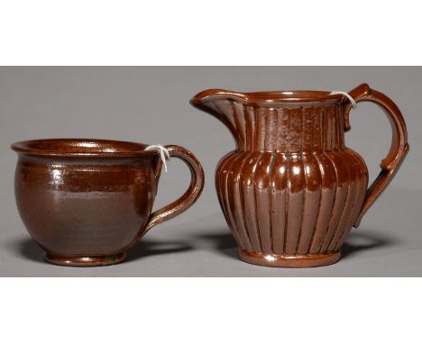 A DERBYSHIRE SALTGLAZED BROWN STONEWARE HANDLED POT OR PORRINGER AND A JUG, BOTH BRAMPTON,LATE 18TH/EARLY 19TH C AND C1840, J