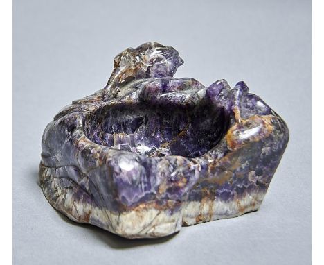 A CHINESE BANDED FLUORSPAR BOWL, THE ROUGHLY TRIANGULAR BOULDER CARVED WITH LOTUS, 20TH C, 13CM L Condition reportGood condit