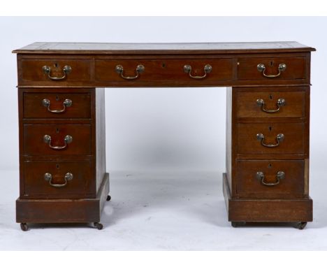 A VICTORIAN MAHOGANY PEDESTAL DESK, C1880, THE RECTANGULAR TOP WITH MOULDED LIP, INSET GILT TOOLED GREEN LEATHER WRITING SURF