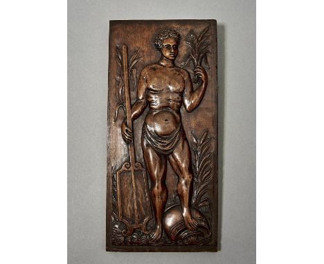 A NORTHERN EUROPEAN WALNUT PANEL, LATE 19TH C, CARVED WITH&nbsp; A SEMI NAKED YOUTH, WATERS FLOWING FROM A JAR UNDER&nbsp; HI