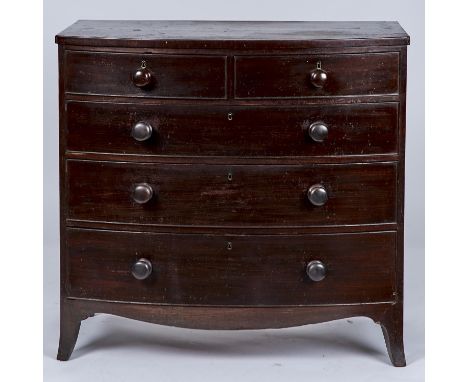 A POST REGENCY MAHOGANY BOW FRONTED CHEST OF TWO SHORT AND THREE LONG GRADUATED, COCKBEADED DRAWERS, BOWED APRON AND SPLAYED 