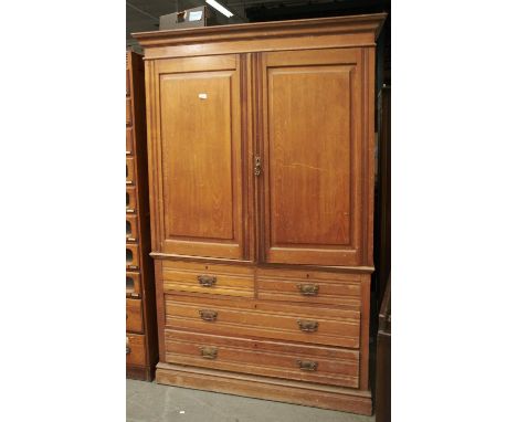 A LATE VICTORIAN ASH LINEN PRESS, C1880, WITH FLARED CORNICE ABOVE A PAIR OF RAISED AND FIELDED PANEL DOORS REVEALING FLOOR S