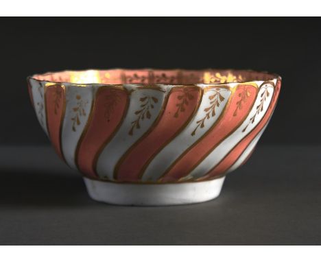AN ENGLISH PORCELAIN SPIRALLY FLUTED APRICOT AND GILT SLOP BASIN, C1805-10, 16CM DIAM Condition reportFaint star crack and we
