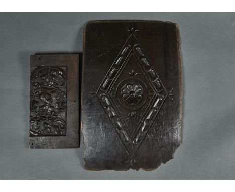 A CARVED OAK PANEL WITH LOZENGE AND ROSETTE, 19TH C OR EARLIER, WARPED, 33 X 49CM AND PART OF ANOTHER, CARVED WITH THE HEAD O