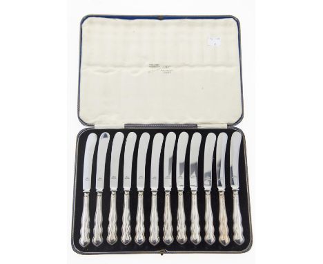 A SET OF TWELVE GEORGE V SILVER HAFTED TEA KNIVES, BY HARRISON FISHER &amp; CO, SHEFFIELD 1931, CASED Condition reportHafts w