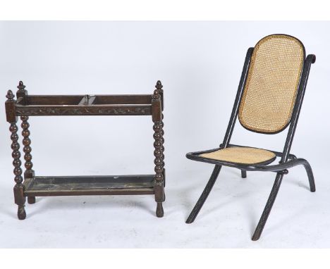 AN EBONISED BENTWOOD FOLDING CHAIR, C1920, ARCHED BACK AND LOZENGE CARVED FRAME, CANED, 90CM H; TOGETHER WITH AN OAK JACOBEAN