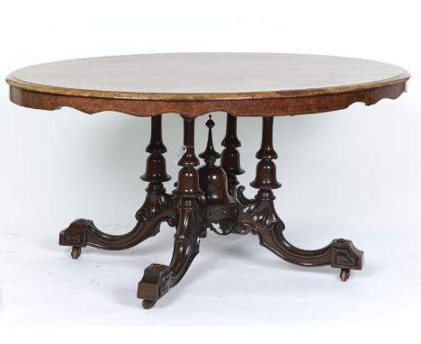 A VICTORIAN BURR WALNUT VENEERED OVAL LOO TABLE, C1870, THE WELL FIGURED QUARTERED TOP INLAID WITH A BORDER OF RIBBON, PARQUE