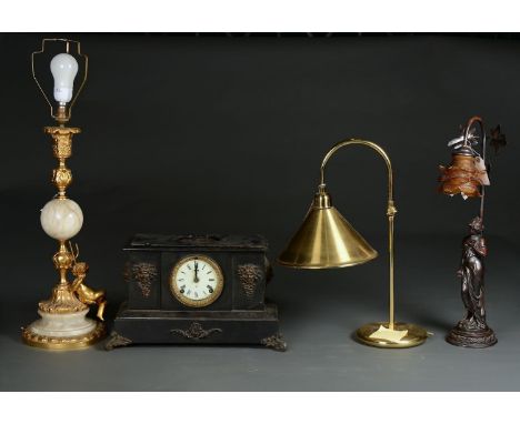 A REPRODUCTION RESIN FIGURAL LAMP, IN ART NOUVEAU STYLE, WITH RISING BACK SET LEAFAGE AND WITH FRILLED AMBER GLASS SHADE, 55C