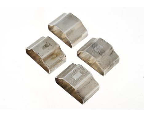 A SET OF FOUR ELIZABETH II SILVER NAPKIN RINGS, ENGINE TURNED, BY C J VANDER LTD, LONDON 1955, 4 OZS 3DWTS Condition reportAs