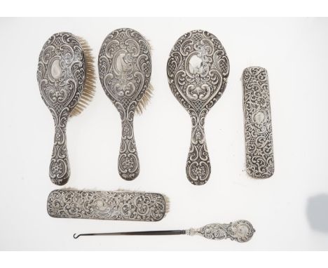 AN EDWARDIAN SILVER&nbsp; &nbsp; BRUSH SET, EMBOSSED WITH TRELLIS AND ROCAILLE, BY WILLIAM M HAYES, BIRMINGHAM 1902 AND C, AN