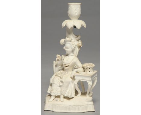 AN ENGLISH BISCUIT PORCELAIN CANDLESTICK FIGURE, POSSIBLY GEORGE COCKER'S DERBY MANUFACTORY, C1820, AFTER A MEISSEN ORIGINAL,