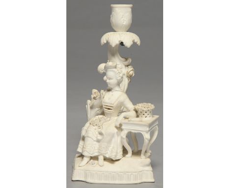 AN ENGLISH BISCUIT PORCELAIN CANDLESTICK FIGURE, POSSIBLY GEORGE COCKER'S DERBY MANUFACTORY, C1820, AFTER A MEISSEN ORIGINAL,