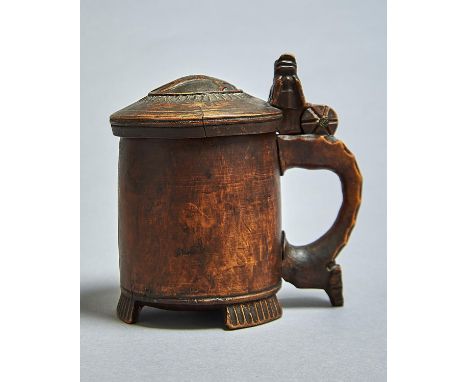 A NORWEGIAN BIRCH&nbsp; TANKARD, C1800, THE DOMED LID CARVED WITH A LION AND SIMILAR THUMBPIECE ABOVE THE NOTCHED HANDLE, ON 