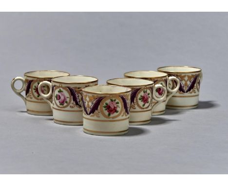 A SET OF SIX MINTON COFFEE CANS, C1810, THE BORDER PAINTED WITH GILT WREATH MEDALLIONS OF SINGLE ROSES FLANKED BY PURPLE AND 