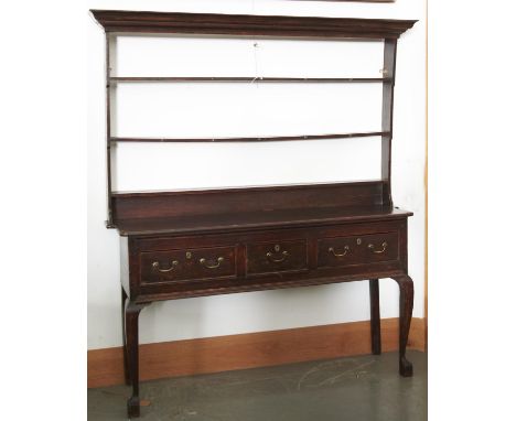 A GEORGE II PINE DRESSER, C1750, FLARED CORNICE ABOVE THREE SHELF BACK, THE BASE WITH SHAPED SIDES, THE FRONT FITTED ONE SHOR