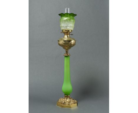 A VICTORIAN BRASS OIL LAMP, LATE 19TH C, WITH FROSTED&nbsp; GREEN GLASS PILLAR, THE OGEE FOUNT EMBOSSED WITH FLOWERS AND SCRO