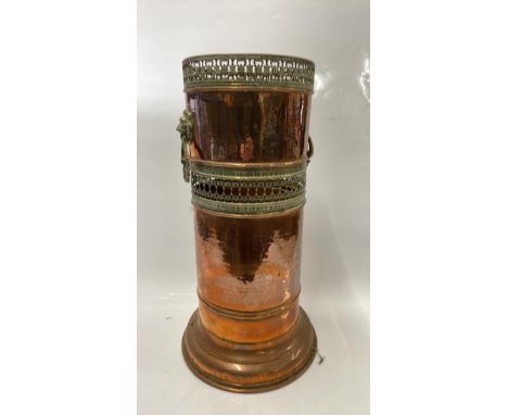 COPPER TWIN HANDLED STICK STAND WITH PIERCED DECORATION