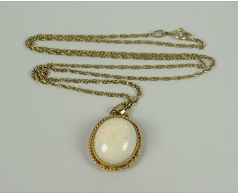 A LARGE WHITE OPAL OVAL PENDANT within 9ct gold rope frame on 9ct necklace, 8.1grams approx.