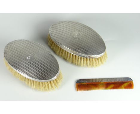 PAIR OF SILVER OVAL ENGINE TURNED BRUSHES with engraved initials to cartouche together with similar silver-handled comb, mixe