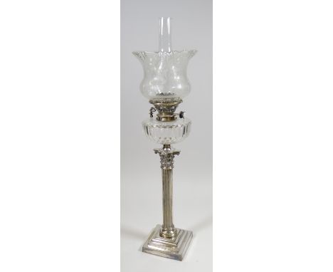 AN ANTIQUE SILVER PLATED CORINTHIAN COLUMN OIL LAMP on a stepped base, with cut-glass reservoir & etched shade, converted to 