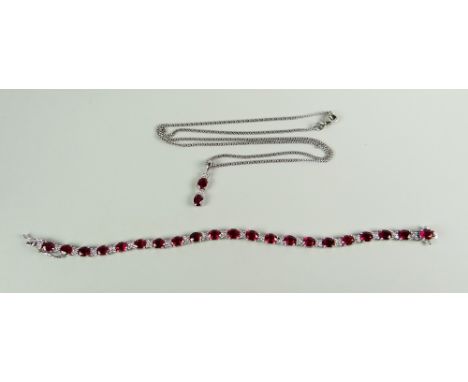 AN 18K WHITE GOLD RUBY &amp; DIAMOND SET BRACELET of alternating flower head diamonds &amp; oval ruby pattern (twenty-one in 