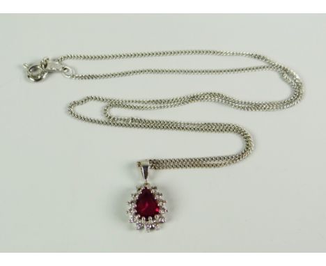 AN 18CT WHITE GOLD PEAR SHAPED RUBY &amp; DIAMOND PENDANT on 18ct white gold chain, 5.3grams approx (in box )