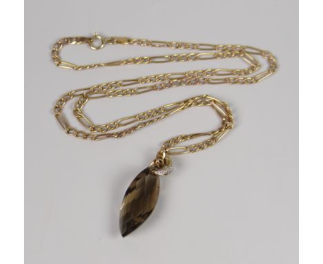 A 9CT YELLOW GOLD FIGARO CHAIN, 3.4grams & smoky quartz pendant