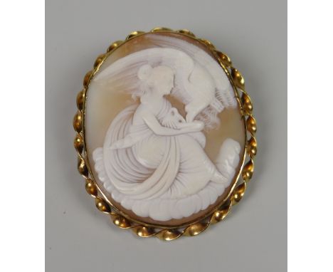 A FINE YELLOW METAL ANTIQUE CAMEO BROOCH PORTRAIT of maiden feeding bird (in associated box)