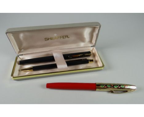 A 1996 SPECIAL EDITION CHRISTMAS TRIUMPH IMPERIAL FOUNTAIN PEN 'Holly' with berry red body & holly decorated cap, 23ct electr