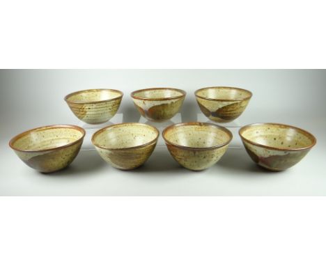 SET OF SEVEN DAVID LLOYD JONES STUDIO POTTERY BOWLS with mottled glaze, potter's mark, 13cms diam